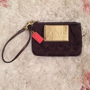 Brown Coach Wristlet with “C” pattern/gold accents